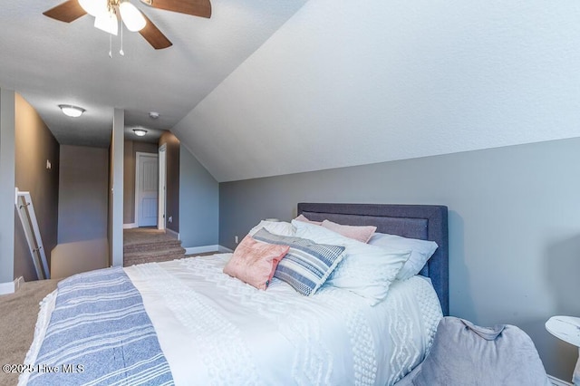 carpeted bedroom with baseboards, ceiling fan, and lofted ceiling