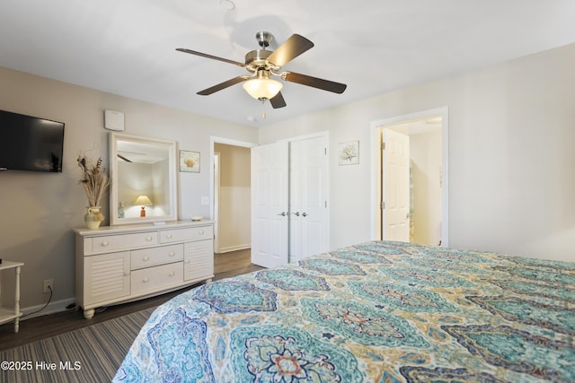 bedroom featuring ceiling fan, baseboards, and dark wood-type flooring