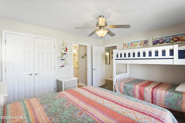 bedroom featuring ceiling fan, a closet, and wood finished floors