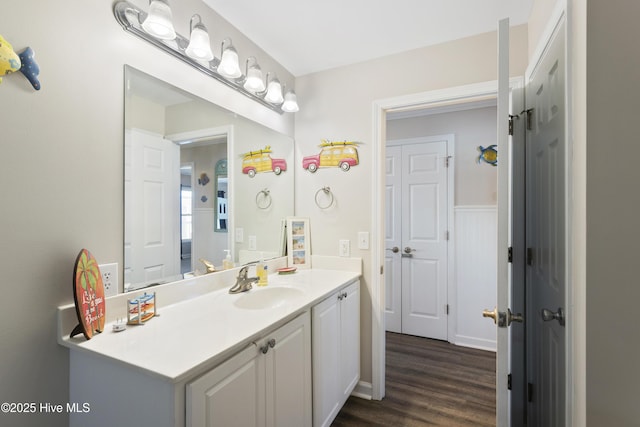 bathroom featuring wood finished floors and vanity