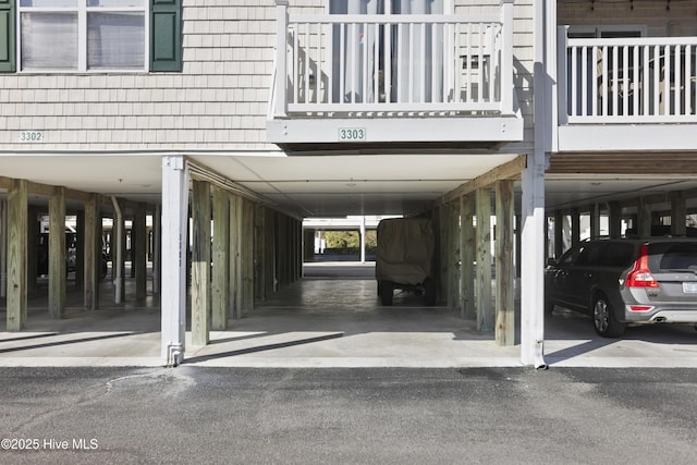 garage featuring a carport