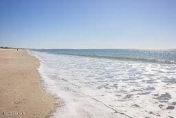 view of water feature with a beach view