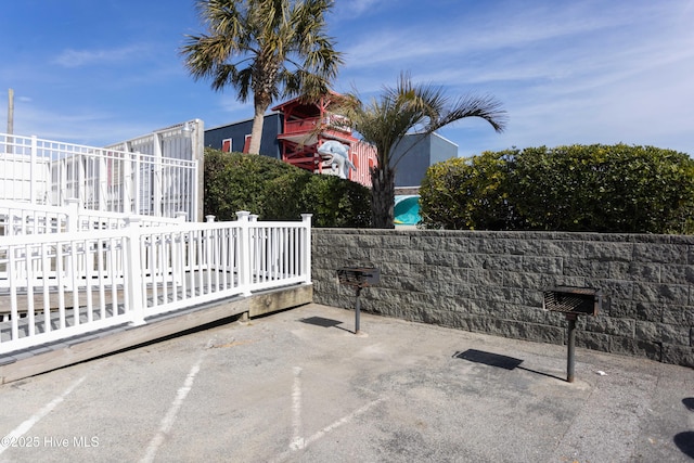 view of patio featuring fence