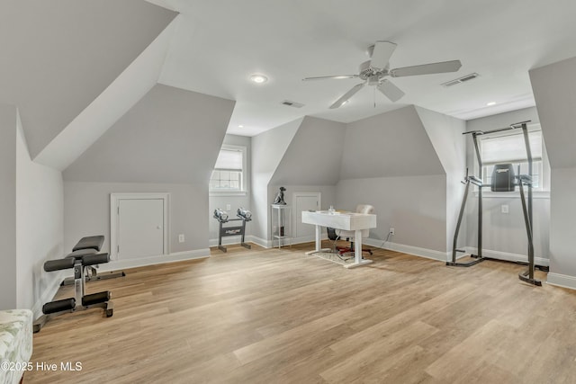 interior space featuring light wood-style floors, baseboards, and visible vents