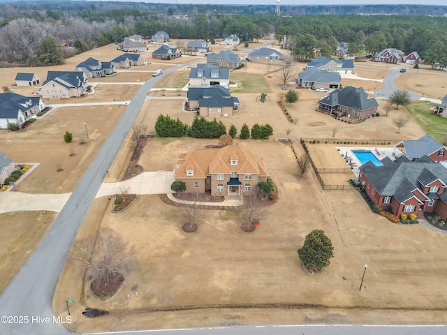 birds eye view of property with a residential view