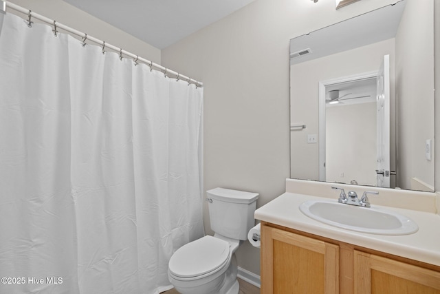 full bathroom featuring visible vents, vanity, and toilet