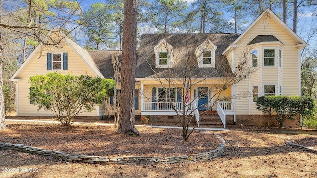 view of front of property with a shingled roof and a porch