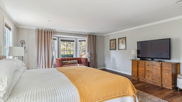 bedroom with baseboards, dark wood finished floors, and crown molding