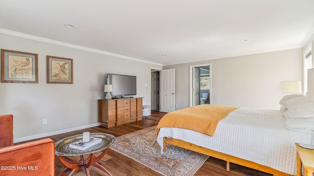 bedroom featuring baseboards, wood finished floors, and ornamental molding