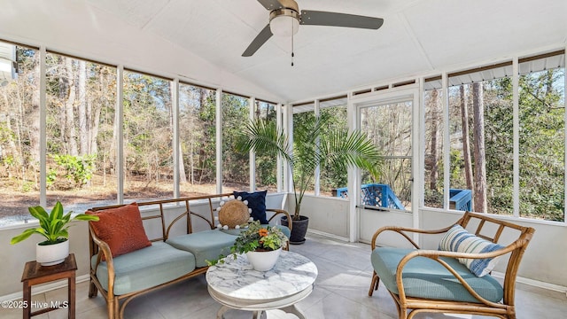 sunroom / solarium featuring vaulted ceiling and a ceiling fan
