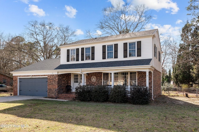 view of front of home with a front lawn, covered porch, concrete driveway, a garage, and brick siding