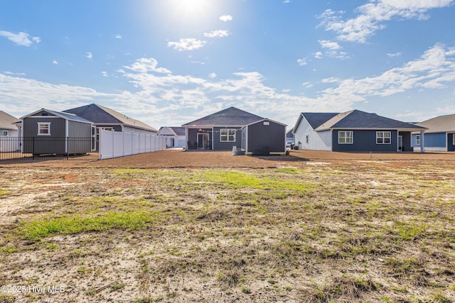 view of yard featuring a residential view and fence