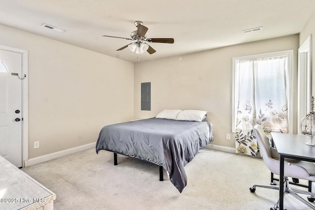 carpeted bedroom featuring electric panel, visible vents, and baseboards