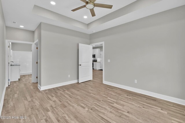 147 NE 18th St, Oak Island, NC 28465 - full bathroom featuring double vanity, wood finished floors, and baseboards