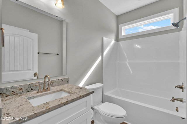 147 NE 18th St, Oak Island, NC 28465 - full bath featuring toilet, vanity, and tub / shower combination