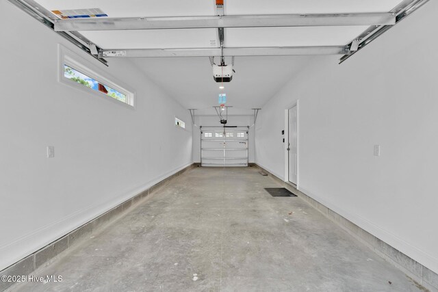 147 NE 18th St, Oak Island, NC 28465 - garage with a garage door opener and baseboards