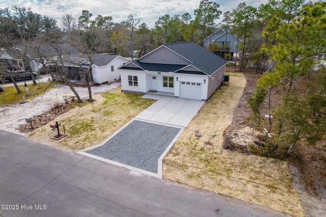 147 NE 18th St, Oak Island, NC 28465 - aerial view of property and surrounding area with nearby suburban area