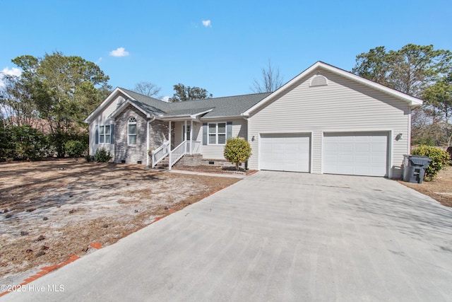 ranch-style home with brick siding, an attached garage, a shingled roof, crawl space, and driveway