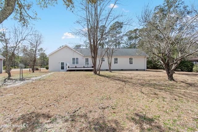 rear view of house featuring crawl space