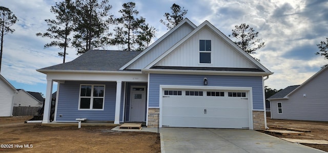 3789 Summer Breeze Ct NE, Bolivia, NC 28422 - view of front of house with board and batten siding, concrete driveway, and a shingled roof