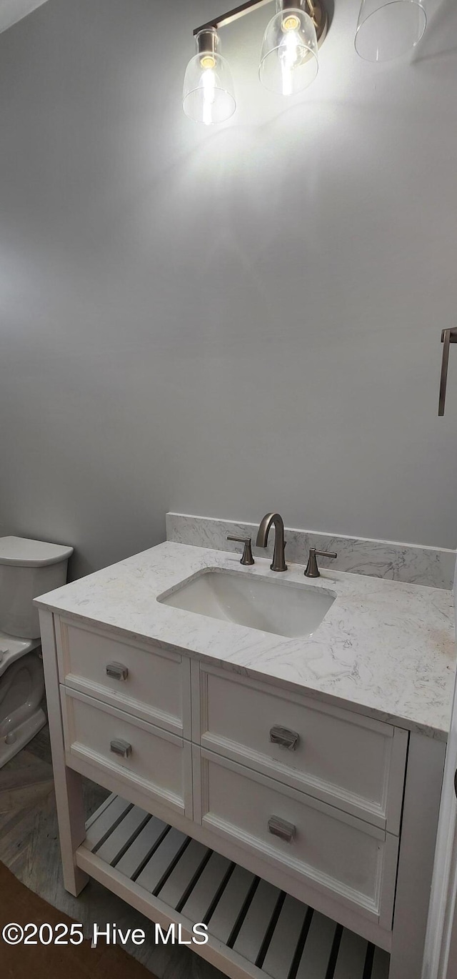 bathroom with vanity and toilet