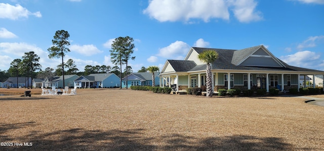 exterior space with covered porch and a residential view