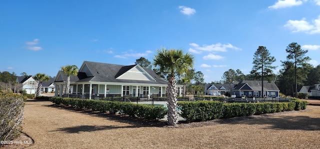 rear view of property with fence