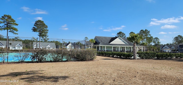 surrounding community featuring a residential view and fence