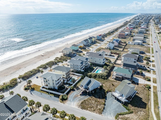 drone / aerial view with a view of the beach and a water view