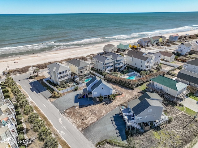 aerial view featuring a residential view, a beach view, and a water view