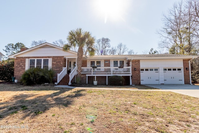 ranch-style house with a porch, brick siding, driveway, and a garage