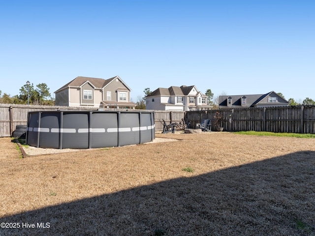 view of yard with a fenced backyard and a fenced in pool