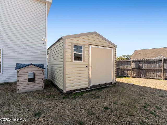 view of shed with fence