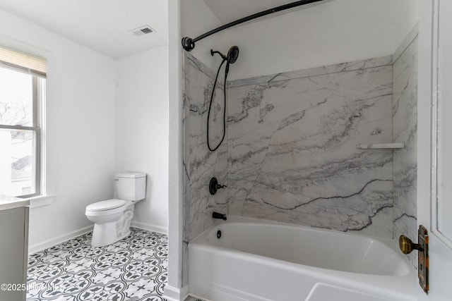 full bath featuring washtub / shower combination, baseboards, plenty of natural light, and toilet