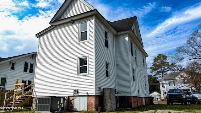 view of home's exterior with central air condition unit