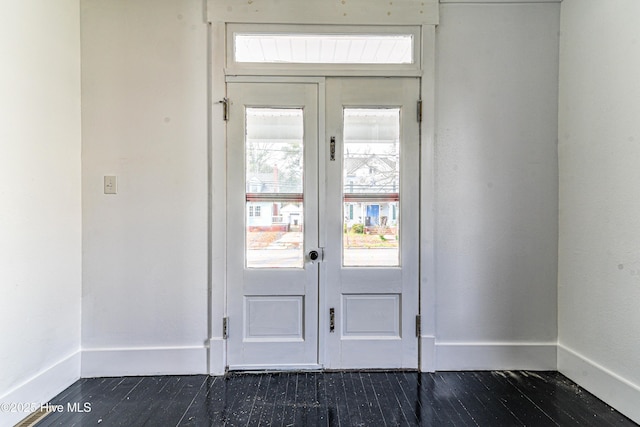 doorway to outside featuring dark wood-style floors, french doors, and baseboards