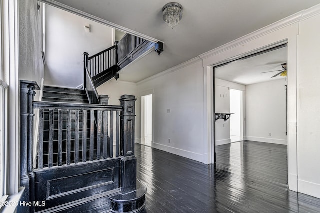 stairway featuring ceiling fan, ornamental molding, wood finished floors, and baseboards