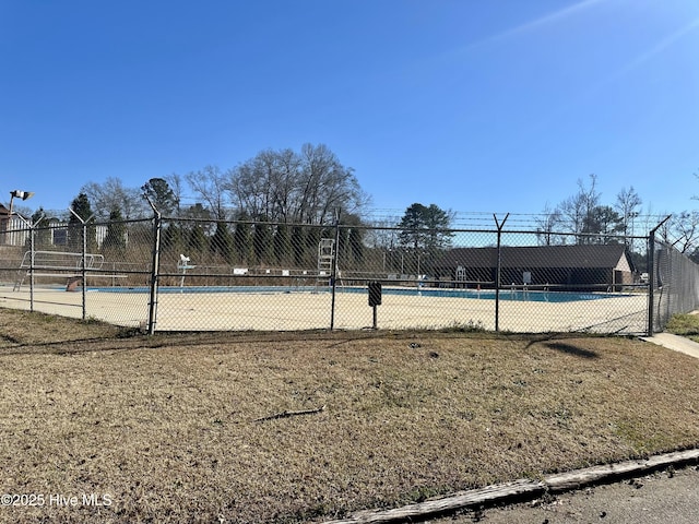view of community featuring fence