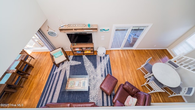 living room with stairway and a wealth of natural light