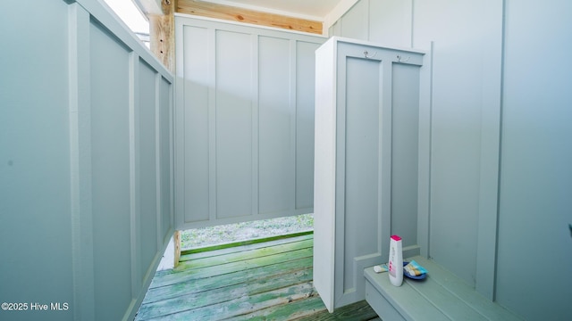 mudroom with a decorative wall