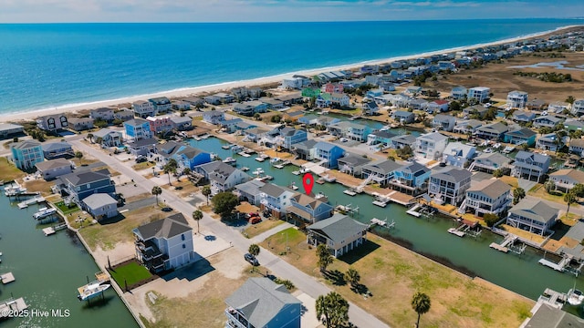 drone / aerial view featuring a water view and a residential view