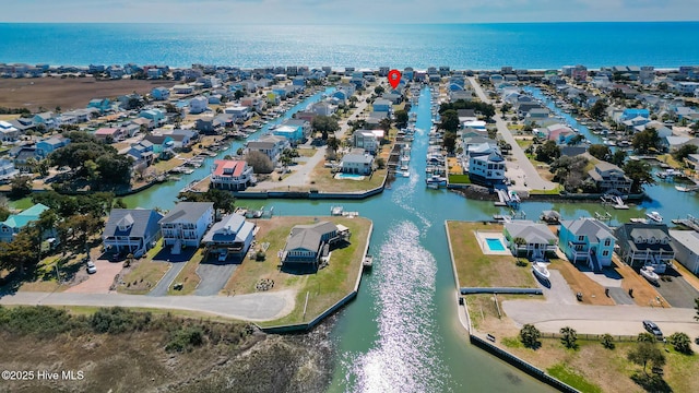 bird's eye view with a residential view and a water view