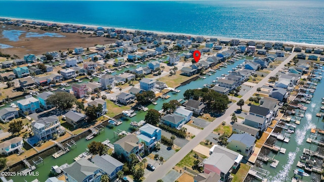 drone / aerial view featuring a residential view and a water view