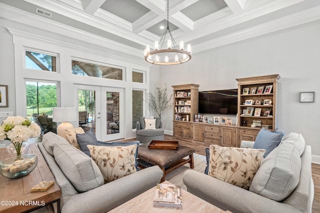 living room featuring a high ceiling, coffered ceiling, visible vents, french doors, and beamed ceiling