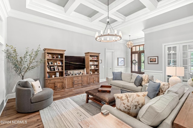 living area featuring wood finished floors, french doors, beamed ceiling, and an inviting chandelier