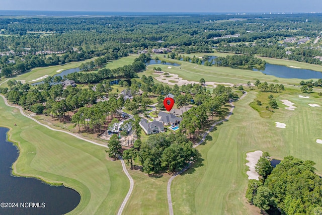 aerial view with golf course view, a water view, and a wooded view