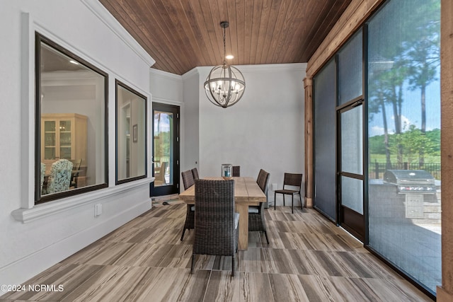 dining space with wooden ceiling, an inviting chandelier, and crown molding