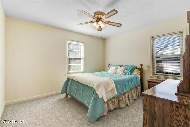 bedroom featuring a ceiling fan, carpet flooring, and baseboards