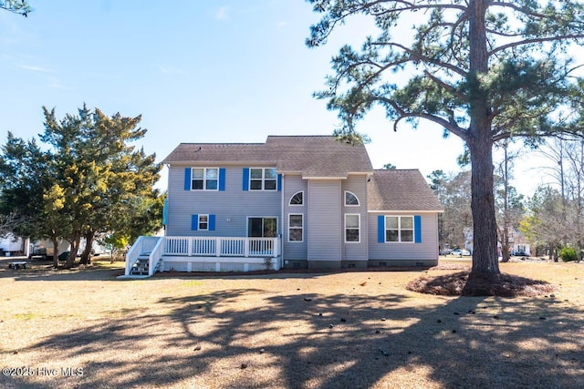 view of front of home with crawl space and a deck