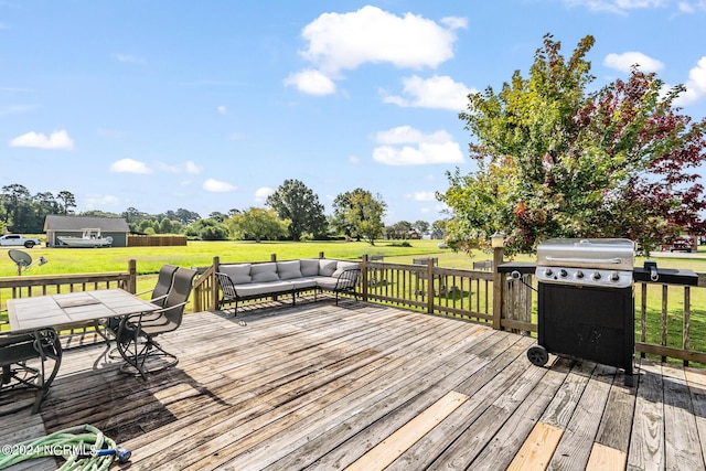 deck with grilling area and a lawn